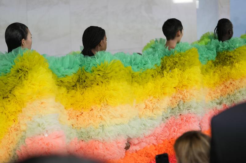 For his finale, Tomo Koizumi sent five models down the runway inside the same giant piece of fabric. AP