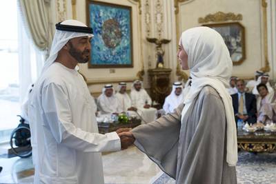 ABU DHABI, UNITED ARAB EMIRATES - September 17, 2019: HH Sheikh Mohamed bin Zayed Al Nahyan, Crown Prince of Abu Dhabi and Deputy Supreme Commander of the UAE Armed Forces (L), receives a member of the Young Arab Media Leaders Programme, during a Sea Palace barza.

( Mohamed Al Hammadi / Ministry of Presidential Affairs )
---