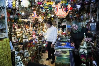 A customer admires a fanous lantern in a shop near Al Aqsa mosque as Ramadan approaches. EPA