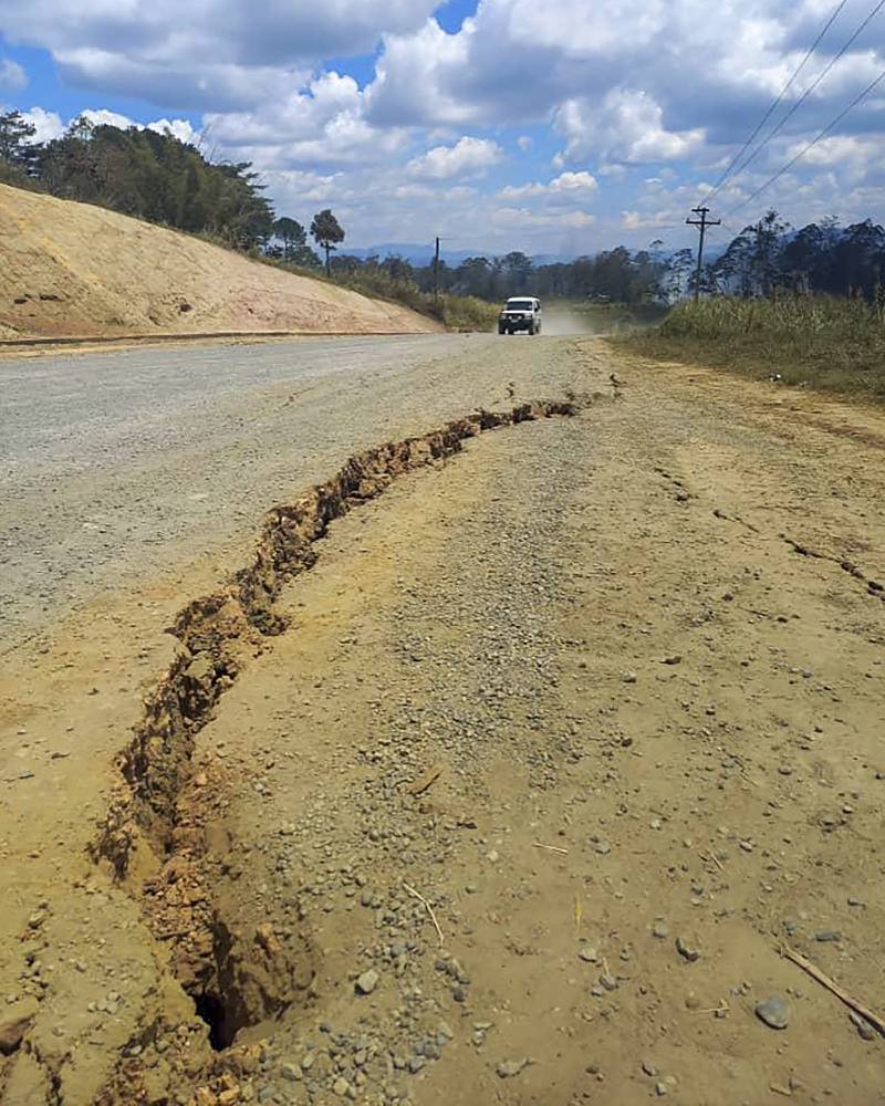 A large crack is seen in a highway near the town of Kainantu, following the powerful quake.