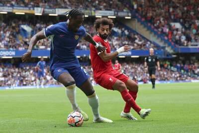 Chelsea goalscorer Axel Disasi, left, challenges Liverpool's Mohamed Salah in the Premier League clash at Stamford Bridge on Sunday, August 13, 2023. AP