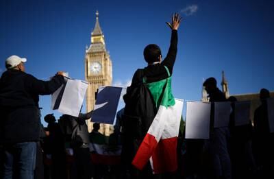 People demonstrate against the Iranian government outside the Houses of Parliament in London following the death of Amini. Reuters