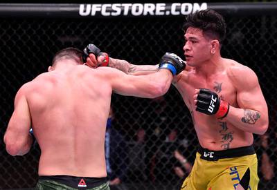 LAS VEGAS, NEVADA - FEBRUARY 13: (R-L) Maki Pitolo punches Julian Marquez in their middleweight fight during the UFC 258 event at UFC APEX on February 13, 2021 in Las Vegas, Nevada. (Photo by Jeff Bottari/Zuffa LLC) *** Local Caption *** LAS VEGAS, NEVADA - FEBRUARY 13: (R-L) Maki Pitolo punches Julian Marquez in their middleweight fight during the UFC 258 event at UFC APEX on February 13, 2021 in Las Vegas, Nevada. (Photo by Jeff Bottari/Zuffa LLC)