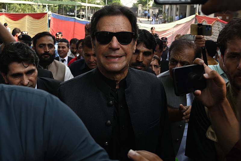 Pakistan's former prime minister Imran Khan leaves the Islamabad High Court in September after apologising for remarks that drew contempt charges. AFP
