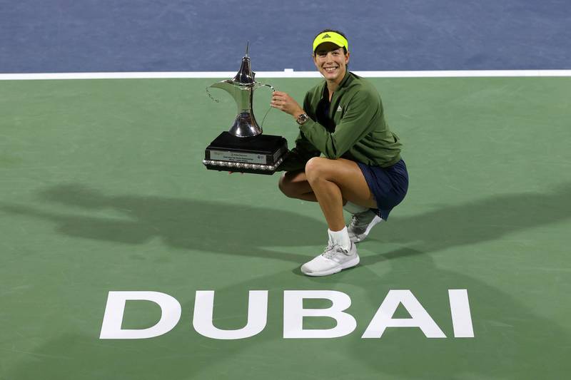 DUBAI, UNITED ARAB EMIRATES - MARCH 13: Garbine Muguruza of Spain poses with the trophy following victory during the Dubai Duty Free Tennis Women's Final match between Barbora Krejcikova and Garbine Muguruza on Day Seven of the Dubai Duty Free Tennis at Dubai Duty Free Tennis Stadium on March 13, 2021 in Dubai, United Arab Emirates. (Photo by Francois Nel/Getty Images)