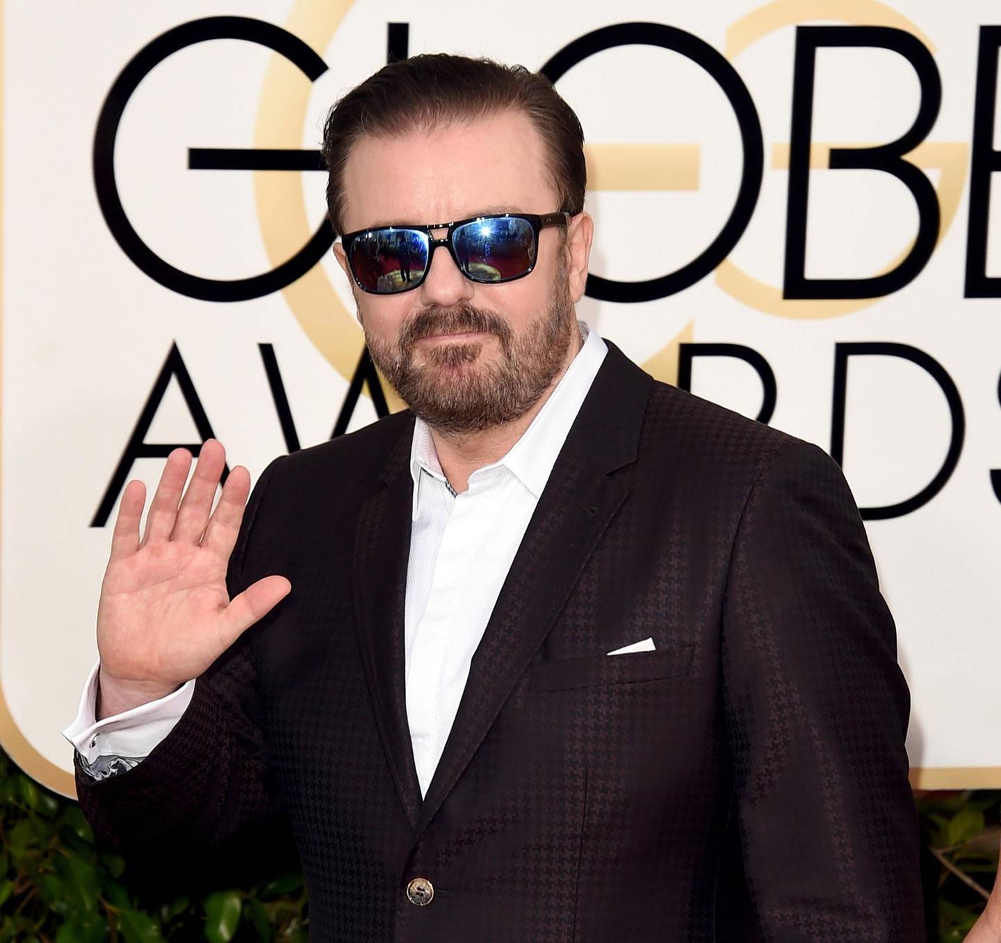 (FILES) In this file photo taken on January 10, 2016, host Ricky Gervais attends the 73rd Annual Golden Globe Awards in Beverly Hills, California.    "Shut up, you disgusting, pill-popping deviant scum!" Those were the words Gervais used to open the star-studded Golden Globes in 2016 -- the last time he hosted Hollywood's most free-wheeling award show. So A-listers in the audience will be on their guard Sunday, when the provocative British comic returns to oversee the boozy prize-giving gala for "the very last time." Gervais' no-holds-barred humor has drawn praise and criticism in previous years, with everyone from Caitlyn Jenner to Roman Polanski considered fair targets for his sharp barbs. / AFP / GETTY IMAGES NORTH AMERICA / Jason Merritt / TO GO WITH AFP STORY by Andrew MARSZAL, "Gervais back to roast Hollywood in 'final' Globes role"
