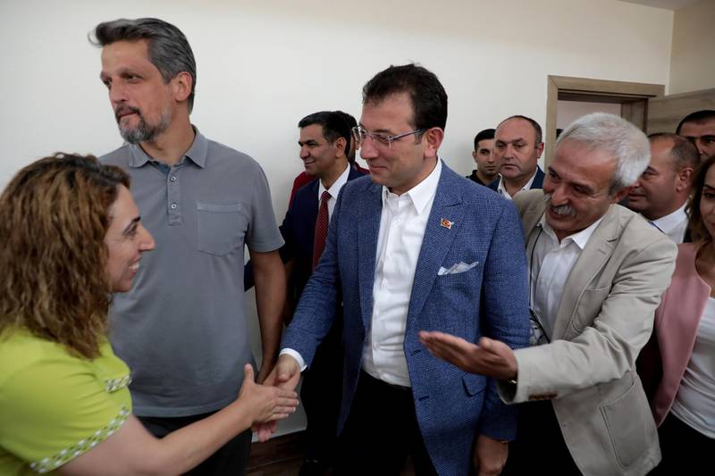FILE PHOTO: Mayor of Istanbul Ekrem Imamoglu meets with dismissed Diyarbakir Mayor Selcuk Mizrakli and pro-Kurdish Peoples' Democratic Party (HDP) lawmaker Saliha Akdeniz in Diyarbakir, Turkey, August 31, 2019. REUTERS/Sertac Kayar/File Photo