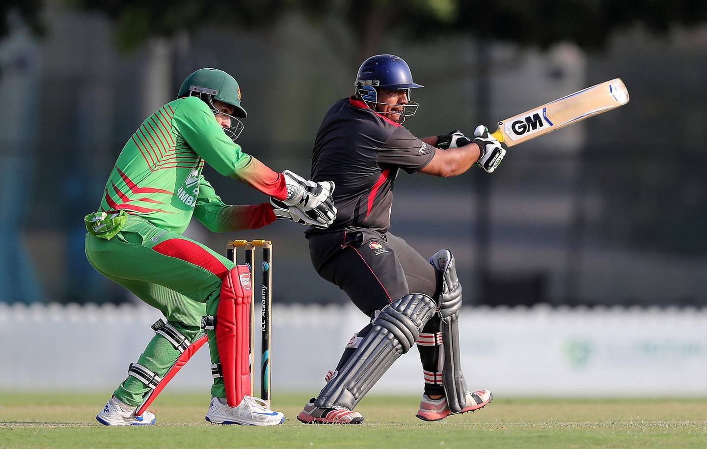 DUBAI , UNITED ARAB EMIRATES , NOV 16   – 2017 :-  Ashfaq Ahmed of UAE team playing a shot during the one day international cricket match against Zimbabwe A team at the ICC Academy in Dubai Sports City in Dubai. Also seen in the photo Peter Moor wicket-keeper of Zimbabwe A team. (Pawan Singh / The National) Story by Paul Radley