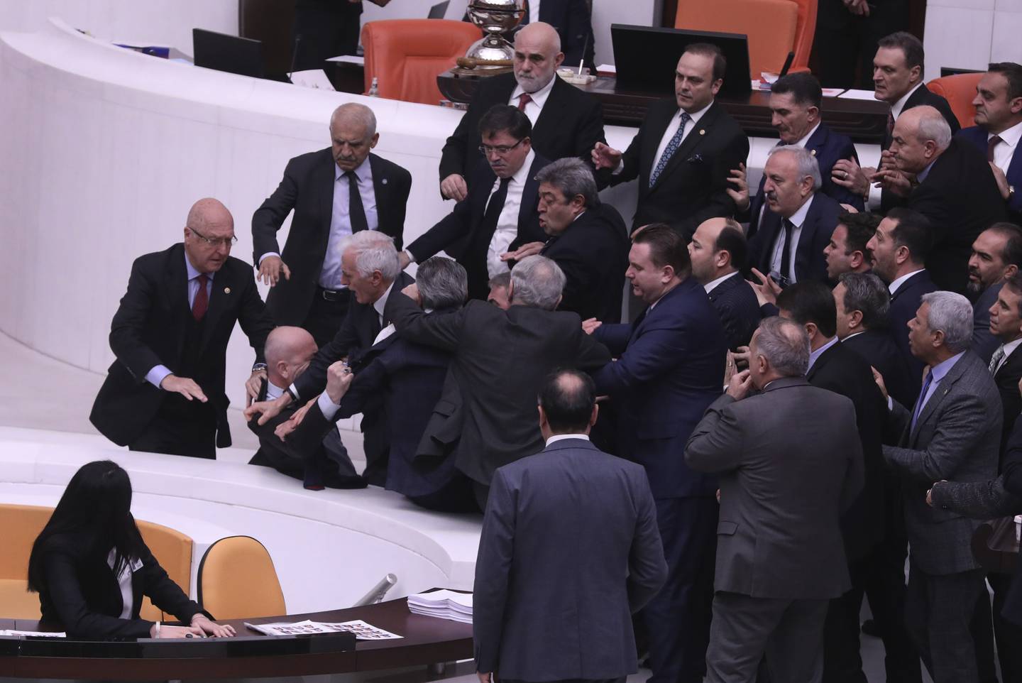 Politicians push each other in the Turkish Parliament in Ankara on Tuesday. AP