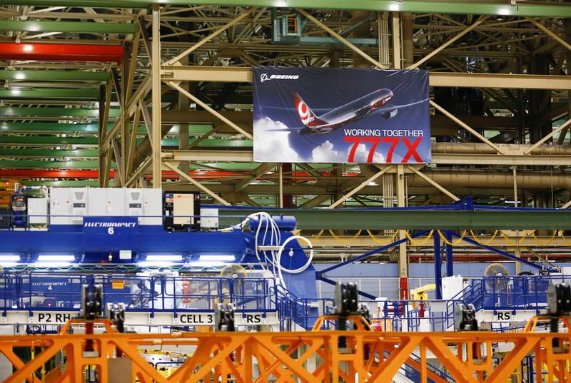 A large 777X banner is seen hanging over the final assembly building floor.