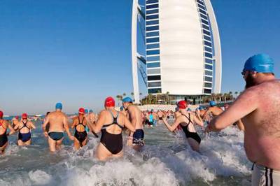 November 11. Participants start a swim around the Burj Al Arab organized by Wild Wadi Waterpark in aid of Médecins Sans Frontières. November 11. Abu Dhabi, United Arab Emirates. Photo: Antonie Robertson/The National