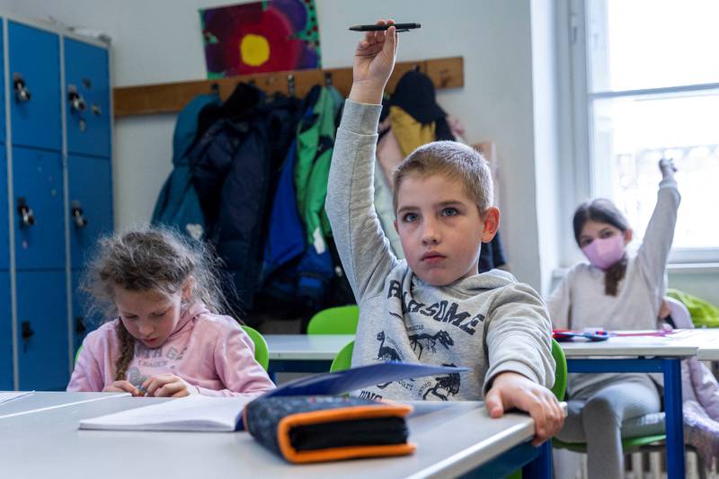 Schoolchildren who fled Ukraine attend a class with children in Vienna, Austria. Unicef says 2.8 million displaced children were in Ukraine and another two million were in other countries. Photo: Reuters
