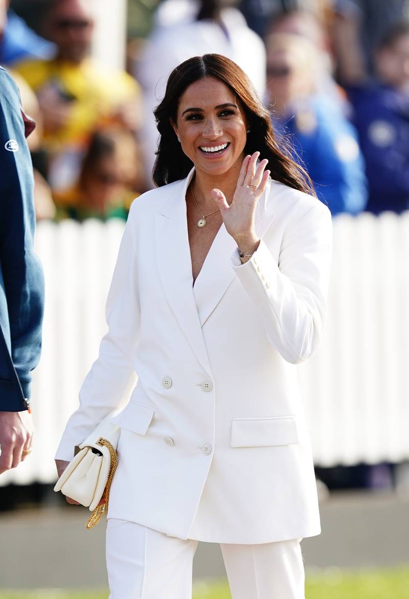 The Duchess of Sussex waves to well-wishers. She and her future husband made their first official appearance as a couple at the 2017 Invictus Games in Toronto, Canada. PA Photo