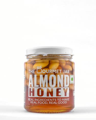 Blanched almonds steeped in organic honey sourced from farms in North India, by The Gourmet Jar and available at Hayawiia  