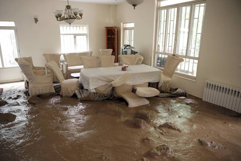 The floods swept mud and debris into this home in Zayegan, Iran. EPA
