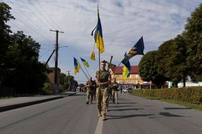 A sombre funeral ceremony for a Ukrainian soldier killed in Polonne, Khmelnytskyi region. AP