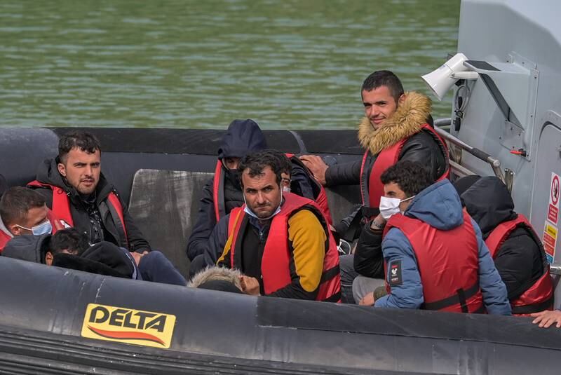 People arrive at Dover Docks after border officials picked up a boat carrying migrants in the English Channel. EPA