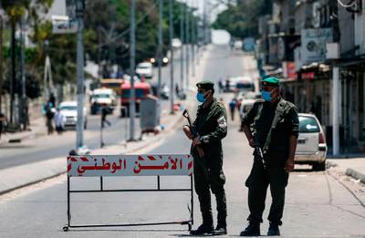 Palestinian security forces man a checkpoint in Gaza City as part of a mock lockdown to prepare for a possible outbreak of coronavirus the blockaded coastal territory. AFP