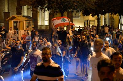 Protesters shout anti-government slogans  in front of the Government Palace in downtown Beirut. EPA