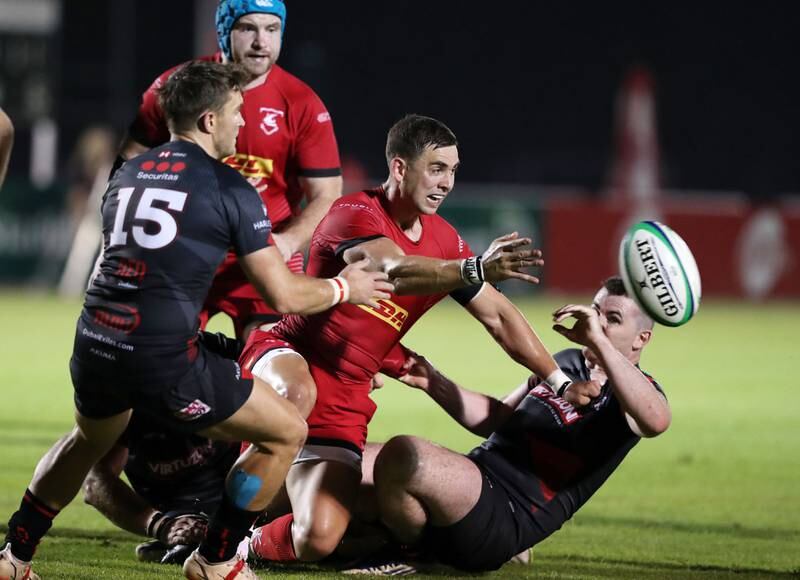 Bahrain's James King is tackled during the match against Dubai Exiles.