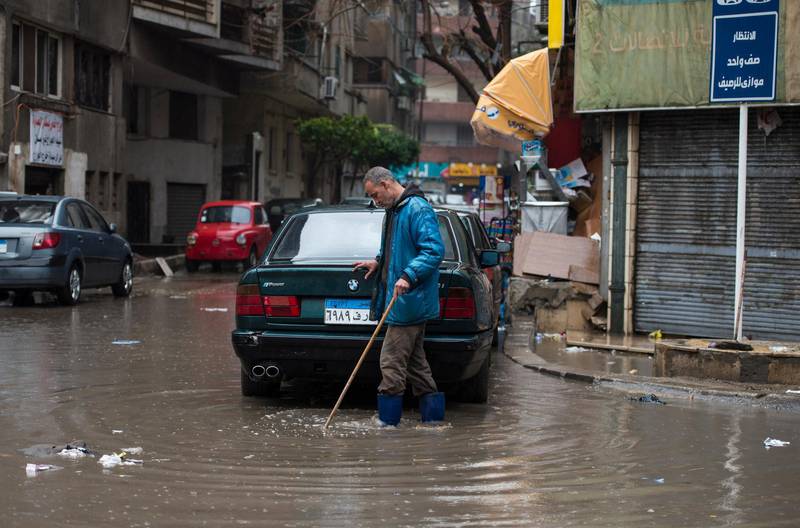 A man walks during a thunderstorm and heavy rains in Cairo. EPA