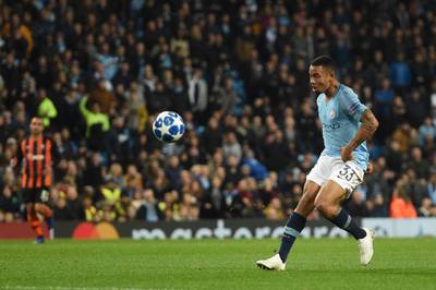 Manchester City's Brazilian striker Gabriel Jesus lobs the keeper to score a hat trick and make it 6-0 during a UEFA Champions League group F football match between Manchester City and Shakhtar Donetsk at the Etihad stadium in Manchester, northwest England on November 7, 2018.  / AFP / Oli SCARFF                          
