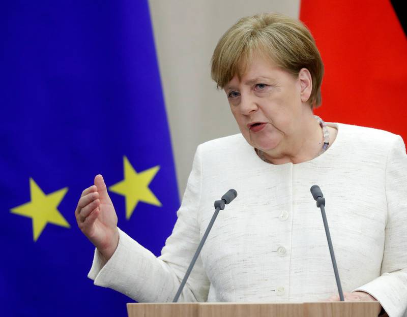 epa06747531 German Chancellor Angela Merkel gestures during a joint news conference with  Russian President Vladimir Putin (unseen) following their talks at the Bocharov Ruchei residence in the Black sea resort of Sochi, Russia, 18 May 2018. Angela Merkel pays a working visit to Russia to discuss the development of Russian-German relations as well as international issues such as Iranian nuclear program, situation in Syria and conflict settlement in Ukraine.  EPA/SERGEI CHIRIKOV
