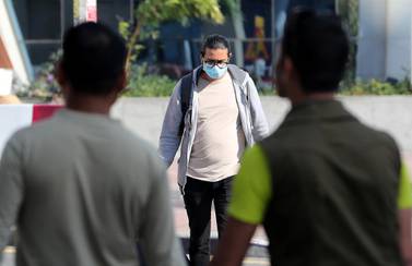 Some UAE residents, such as this man in Bur Dubai, are wearing face masks in the belief this will reduce the risk of catching coronavirus. Pawan Singh / The National