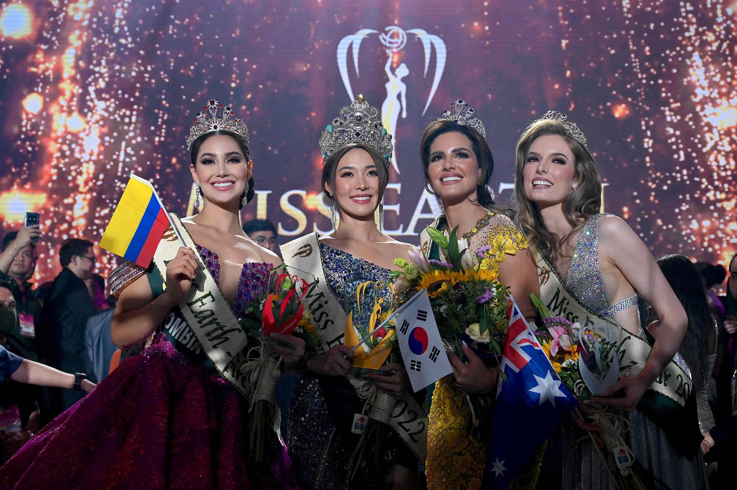 From left, Miss Colombia Andrea Aguilera, Miss Korea Mina Sue Choi, Miss Palestine Nadeen Ayoub and Miss Australia Sheridan Mortlock after the coronation night of the Miss Earth pageant in Manila on November 29, 2022. AFP