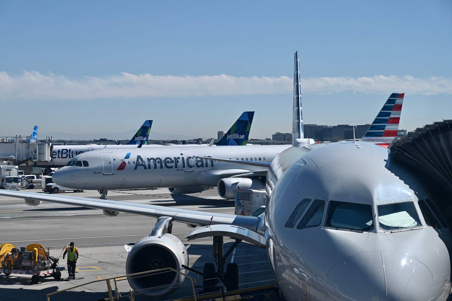 Several major US airlines have dropped face mask requirments on flights.  Photo: Daniel SLIM  /  AFP