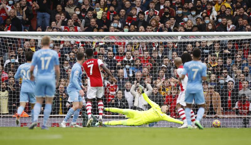 Arsenal's Bukayo Saka scores his team's opener. Reuters