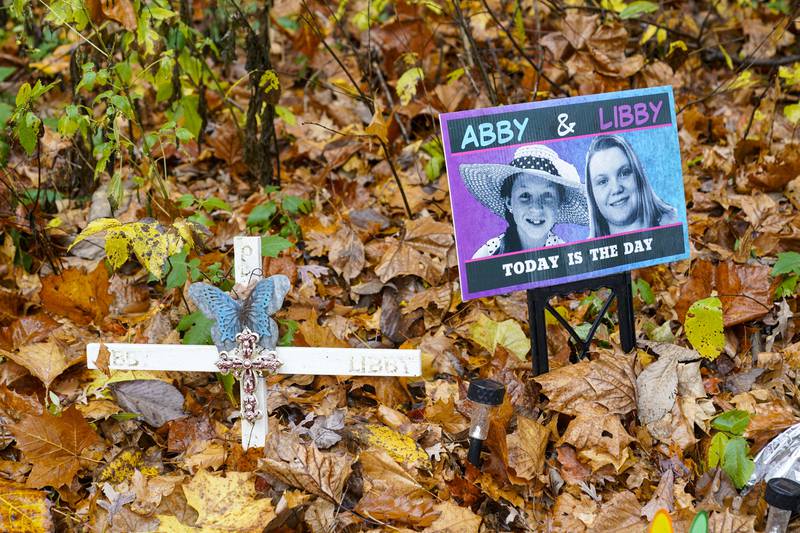 A makeshift memorial to Liberty German, and Abigail Williams near where they were last seen and where the bodies were discovered stands along the Monon Trail leading to the Monon High Bridge Trail in Delphi, Ind. , Monday, Oct.  31, 2022.  The Indiana State Police announced an arrest in the murders of the two teenage girls killed during a 2017 hiking trip in northern Indiana.  (AP Photo / Michael Conroy)