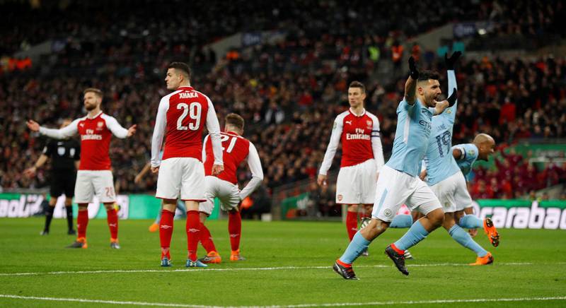 Soccer Football - Carabao Cup Final - Arsenal vs Manchester City - Wembley Stadium, London, Britain - February 25, 2018   Manchester City's Vincent Kompany celebrates scoring their second goal with Sergio Aguero    REUTERS/Peter Nicholls     EDITORIAL USE ONLY. No use with unauthorized audio, video, data, fixture lists, club/league logos or "live" services. Online in-match use limited to 75 images, no video emulation. No use in betting, games or single club/league/player publications. Please contact your account representative for further details.