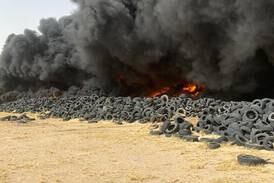 Five firefighting teams deal with a blaze that broke out at a tyre landfill in Al Salmi area. Photo: Kuwait News Agency