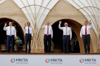 From left, South Korea's President Yoon Suk-yeol, Indonesia's President Joko Widodo, Mr Erdogan, Australia's Prime Minister Anthony Albanese and Mexico's Foreign Minister Marcelo Ebrard. AP
