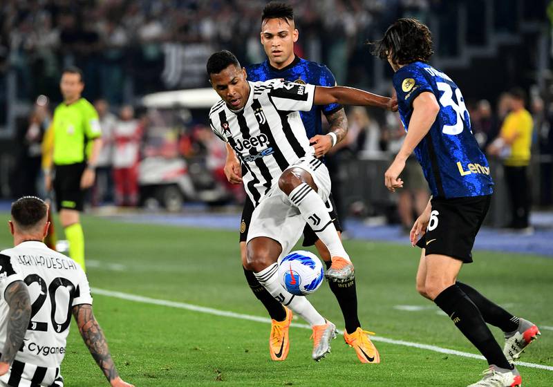 Juventus' Brazilian defender Alex Sandro shields the ball from Inter Milan's Argentine forward Lautaro Martinez. AFP