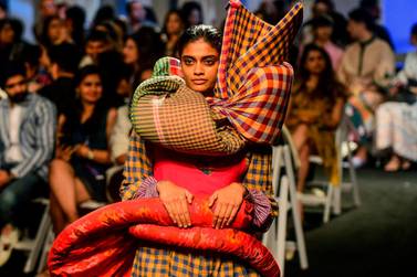 -- IMAGE RESTRICTED TO EDITORIAL USE - STRICTLY NO COMMERCIAL USE -- In this photo taken on February 11, 2020, a model presents a creation by various designers during the Lakme Fashion Week 2020 Summer/Resort fashion show in Mumbai. - -- IMAGE RESTRICTED TO EDITORIAL USE - STRICTLY NO COMMERCIAL USE -- / AFP / Sujit Jaiswal / -- IMAGE RESTRICTED TO EDITORIAL USE - STRICTLY NO COMMERCIAL USE --