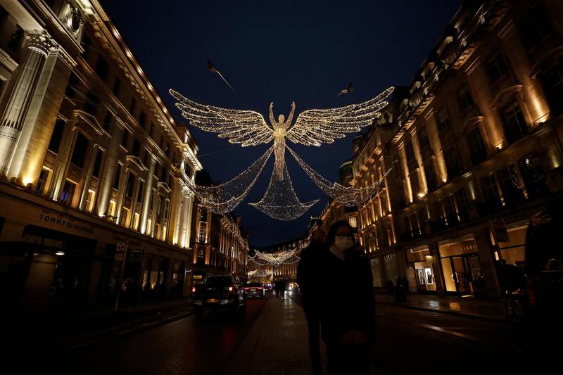 The Regent Street Christmas lights entitled 'The Spirit of Christmas' stand illuminated after being switched on without a formal ceremony amid England's second coronavirus lockdown, in London.  AP Photo