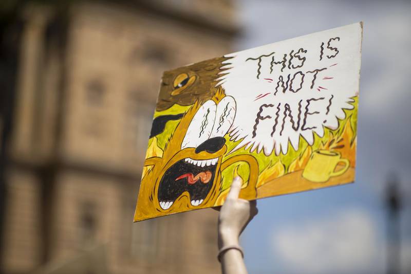 A Climate Emergency Protester holds up a sign at a rally in Brisbane. Getty Images