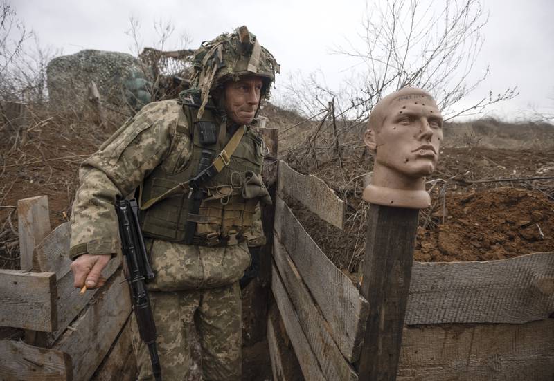 A Ukrainian soldier patrols the line of separation from pro-Russian rebels in Donetsk, Ukraine. AP Photo