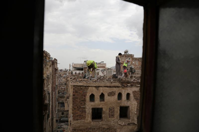 Workers demolish a building damaged by rain in the UNESCO World Heritage site of the old city of Sanaa, Yemen. All photos: REUTERS