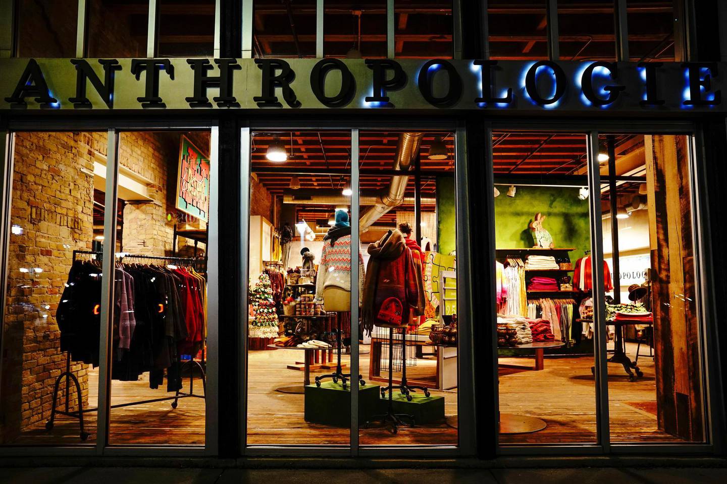A closed Anthropologie women's clothing store is seen at night in Milwaukee's Historic Third Ward neighborhood, as the coronavirus disease (COVID-19) outbreak continues in Milwaukee, Wisconsin, U.S., October 31, 2020. Picture taken October 31, 2020. REUTERS/Bing Guan