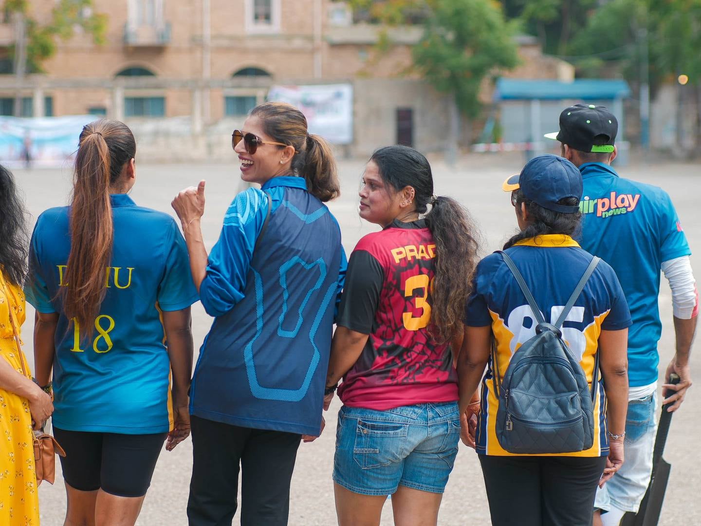 A women's team watch the action at the Université Saint Joseph car park. Photo: Usidu Dilmika Marasinghe