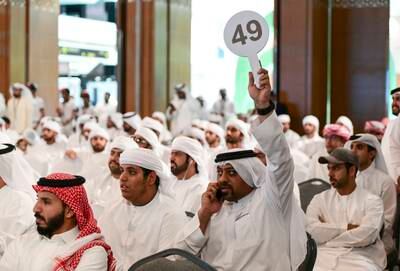 Potential buyers at a falconry auction at Adihex. Khushnum Bhandari / The National 

