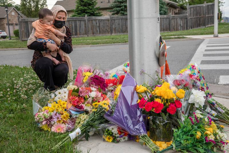 Four people were killed and one was injured in what police in London, Ontario, Canada, say was a hate crime against Muslims. Nafisa Azima and her daughter, Seena Safdari, visit a memorial at the place where a family of five was struck by a hit-and-run motorist. AP Photo