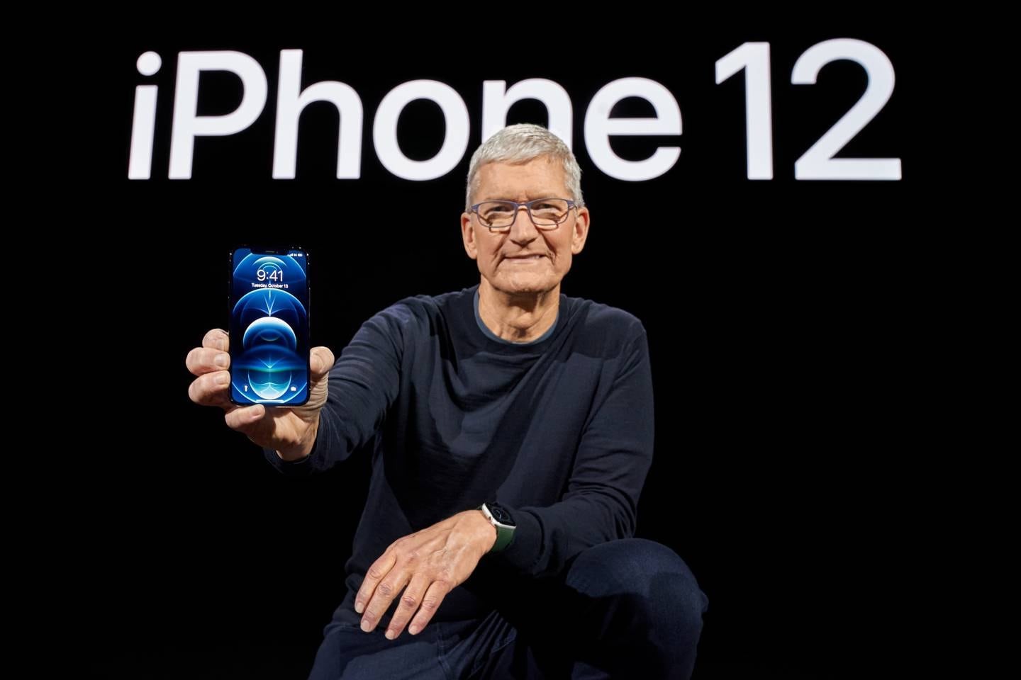 epa08741384 Handout image released by Apple showing Apple CEO Tim Cook showcasing the all-new iPhone 12 Pro during a special event at Apple Park in Cupertino, California, USA, 13 October 2020. Apple is expected to introduce several new products including a new iPhone. EPA/BROOKS KRAFT / APPLE INC. / HO EDITORIAL USE ONLY, NO SALES