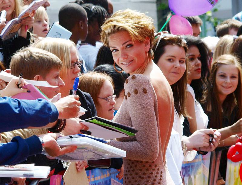 Sarah Harding from the group 'Girls Aloud' meets with fans as she arrives at the premiere of the film,' Horrid Henry', in central London on July 24, 2011. AFP