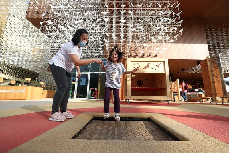 Savannah, aged 4, from the Philippines visits the Poland pavilion on the fifth day of Expo 2020 Dubai. Chris Whiteoak / The National