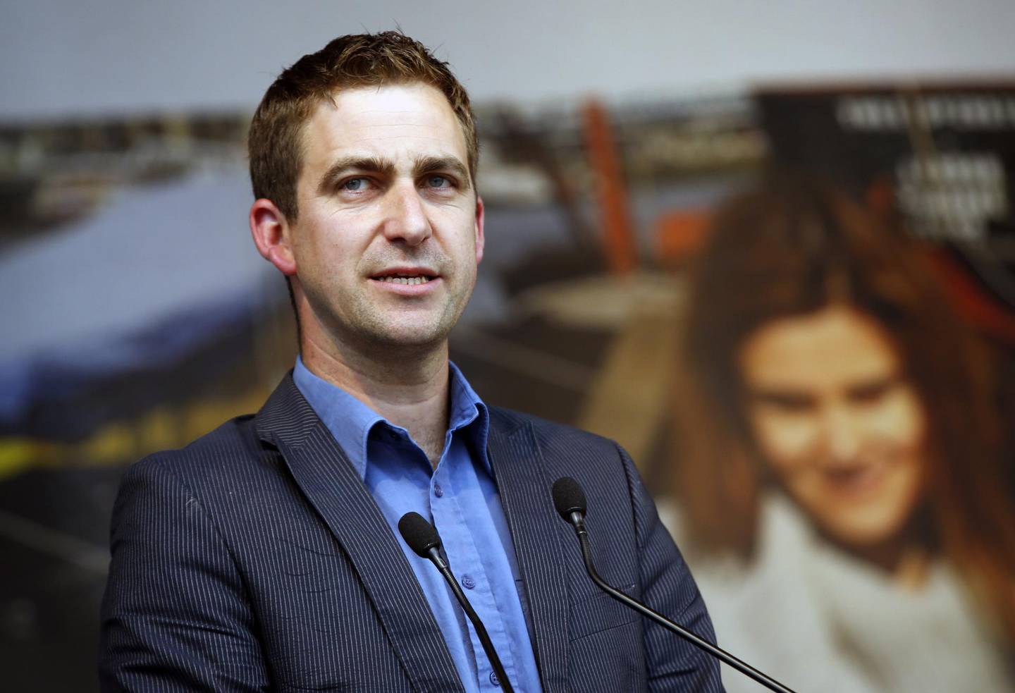FILE - In this Wednesday, June 22, 2016 file photo, Brendan Cox, widower of murdered British MP Jo Cox makes a speech during a gathering to celebrate her life, in Trafalgar Square, London. The widower of a slain British legislator stepped down from two charities on Saturday Feb. 18, 2018, set up in her memory after allegations of sexual misconduct in the past were reported. (AP Photo/Alastair Grant, File)