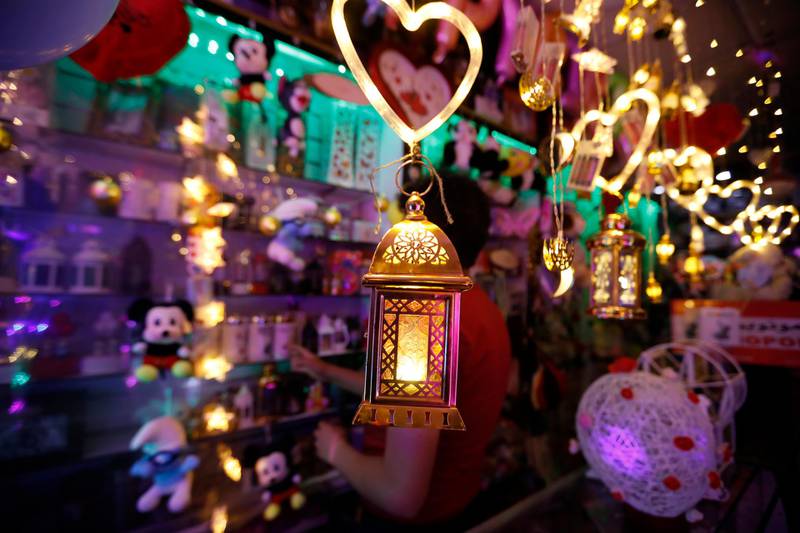 A Yemeni man buys traditional Ramadan lantern, also called Fanous, before the start of Ramadan in Sanaa.  EPA